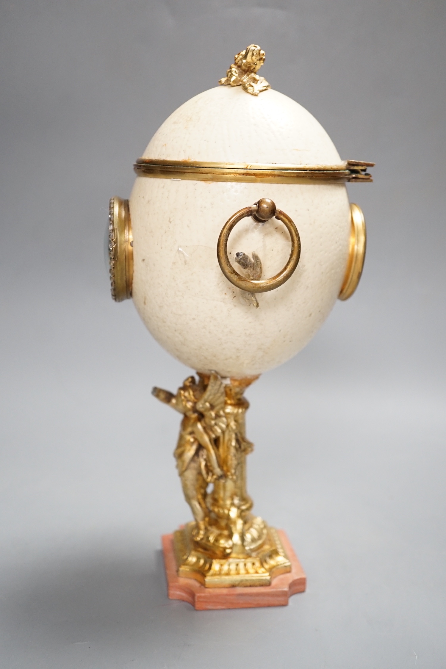 An unusual late 19th/early 20th century ostrich egg timepiece with encased compass and barometer - key included, 29cm high